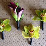 purple and green boutonnieres